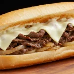 An authentic Philly cheesesteak sandwich loaded with thin sliced beef and gooey melted cheese.