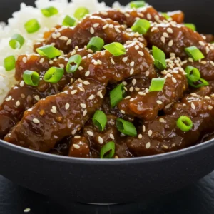 The final plated Easiest Mongolian Beef, a quick and delicious thin sliced steak recipe that's better than takeout.